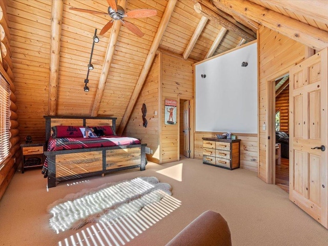 bedroom featuring lofted ceiling with beams, wood ceiling, wood walls, and carpet flooring