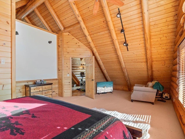 bedroom with lofted ceiling with beams, wood ceiling, wood walls, and carpet floors