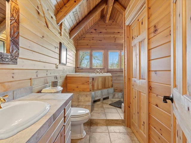 bathroom featuring vaulted ceiling with beams, wood walls, vanity, and toilet