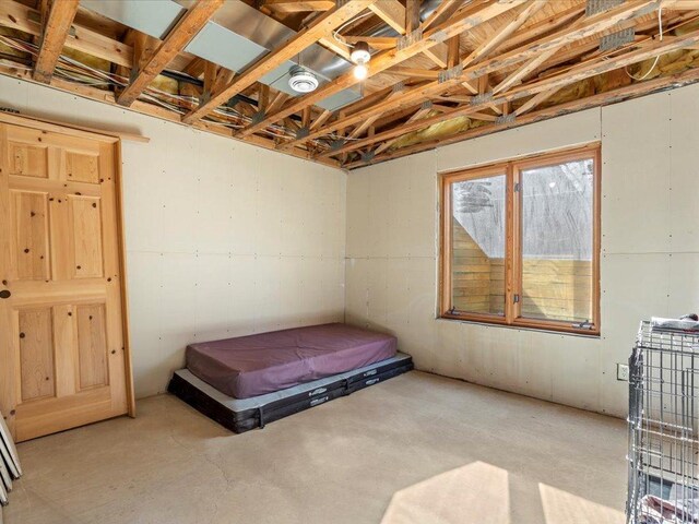 bedroom with concrete flooring