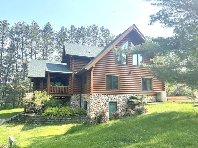 11766 Island Shore Ln, Park Rapids, MN 56470 - back of house with log exterior, a shingled roof, a yard, stone siding, and a balcony