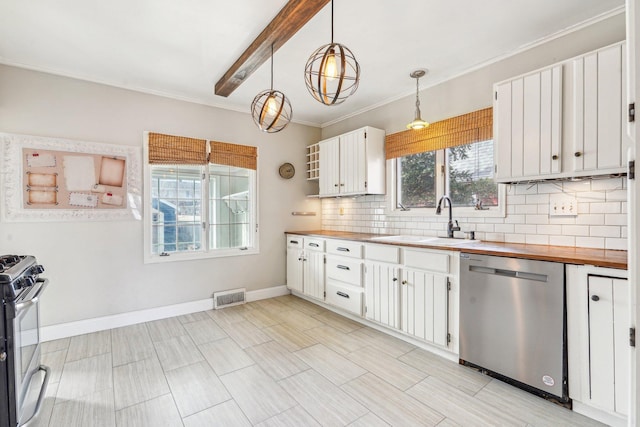 kitchen featuring visible vents, a sink, tasteful backsplash, stainless steel appliances, and wooden counters