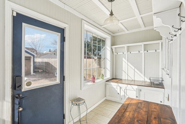 mudroom featuring light wood finished floors and coffered ceiling