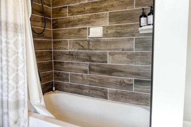 bathroom featuring shower / bath combo with shower curtain