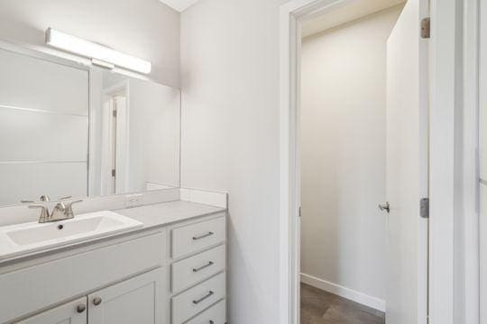 bathroom featuring vanity and baseboards