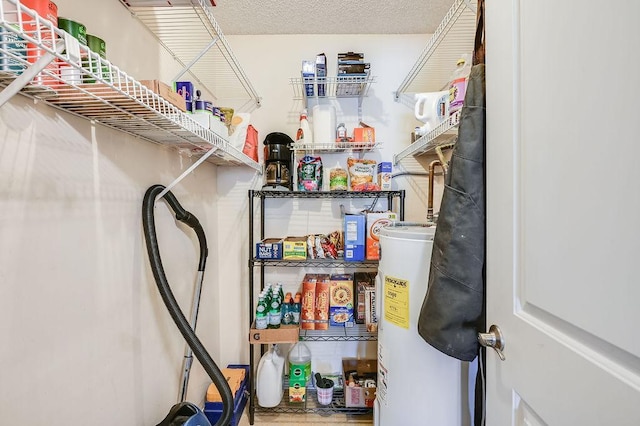 storage area featuring water heater