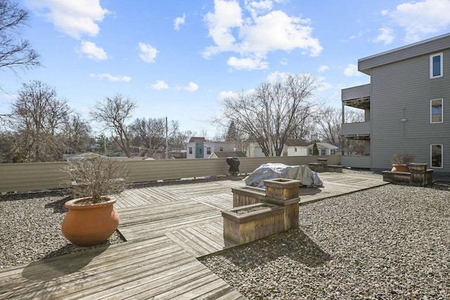 exterior space featuring fence and a deck