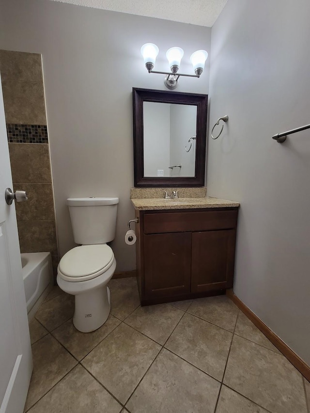 bathroom with tile patterned floors, toilet, vanity, and baseboards