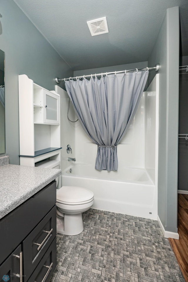 bathroom with visible vents, shower / bathtub combination with curtain, vanity, and toilet