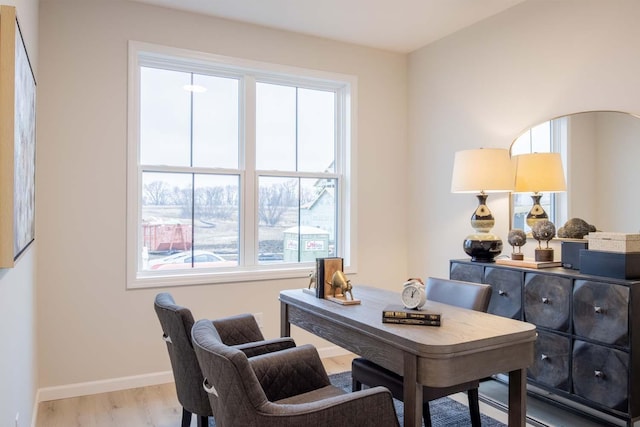 office area featuring baseboards and wood finished floors