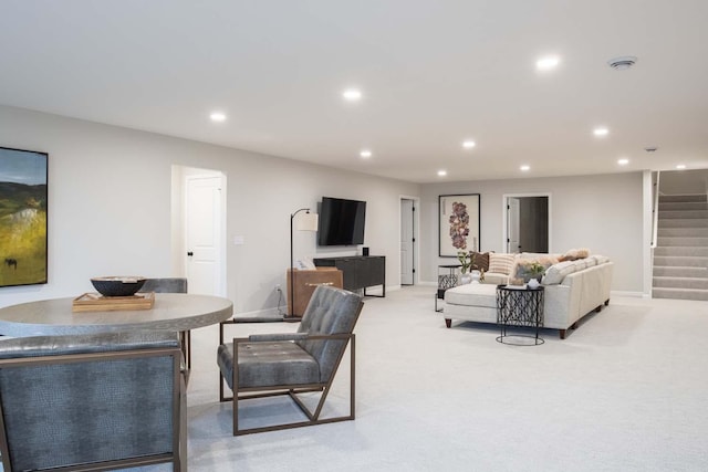 living room with recessed lighting, stairway, light carpet, and baseboards