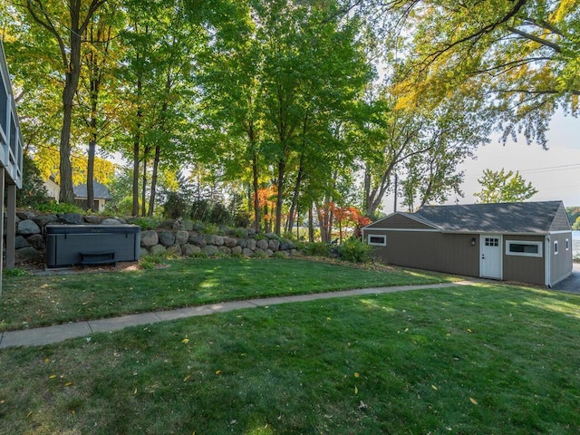 view of yard with an outdoor structure and a hot tub