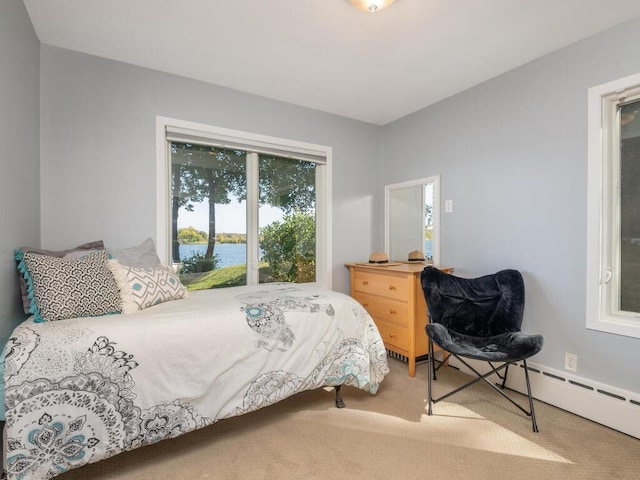 carpeted bedroom featuring a water view