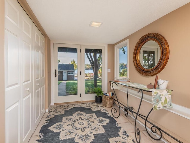 entryway featuring light tile patterned floors