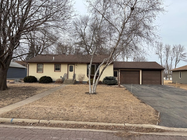 single story home featuring a garage