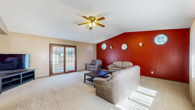 living room featuring carpet floors, a ceiling fan, and vaulted ceiling