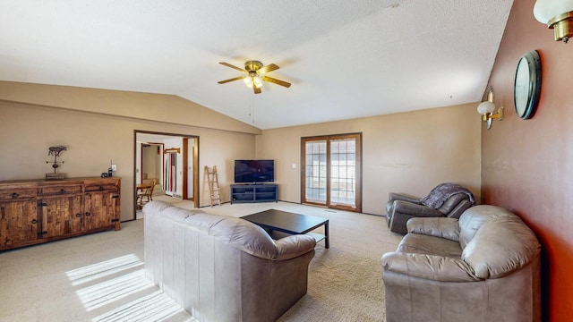 living room with light carpet, a textured ceiling, a ceiling fan, and lofted ceiling