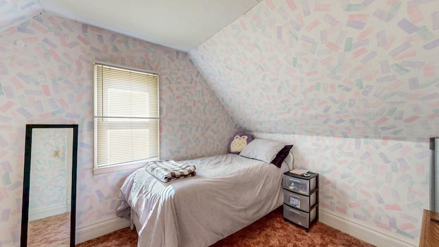 bedroom with wallpapered walls, vaulted ceiling, carpet flooring, and baseboards