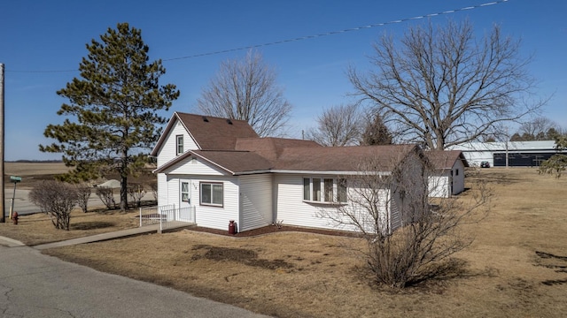 view of front of home with a shingled roof