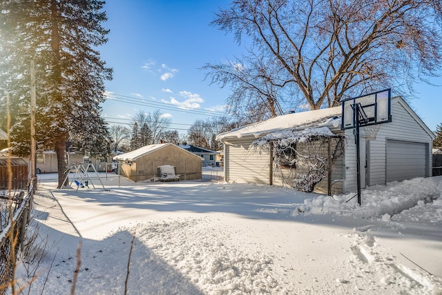 exterior space featuring an outdoor structure and a garage