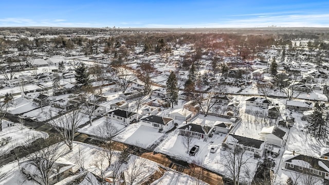 snowy aerial view featuring a residential view