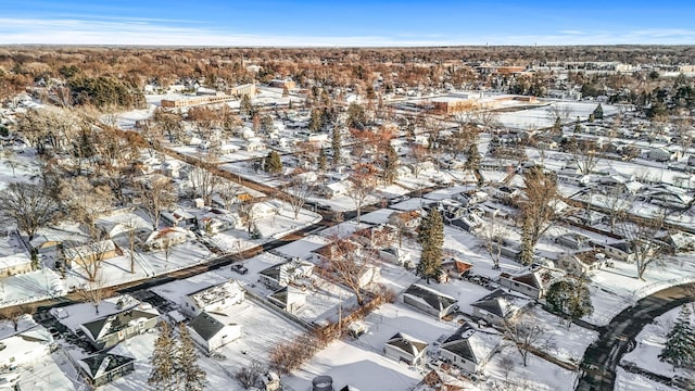 snowy aerial view featuring a residential view