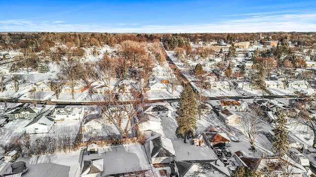 snowy aerial view featuring a residential view