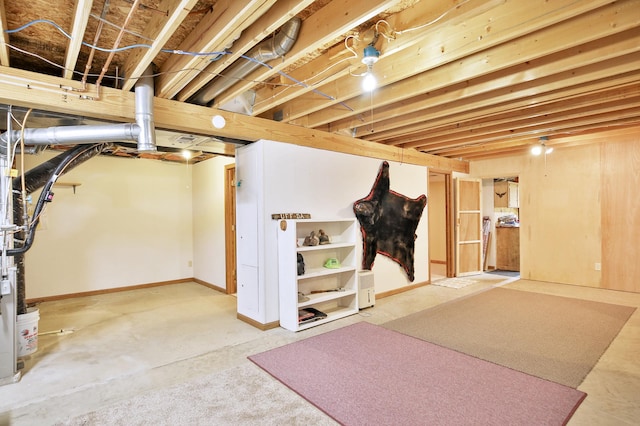 unfinished basement featuring baseboards