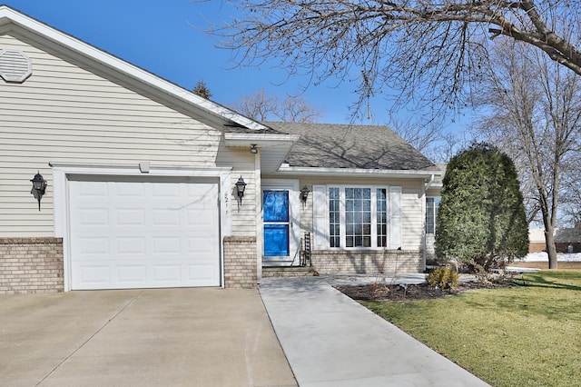 view of front of house featuring brick siding, a front lawn, concrete driveway, roof with shingles, and a garage