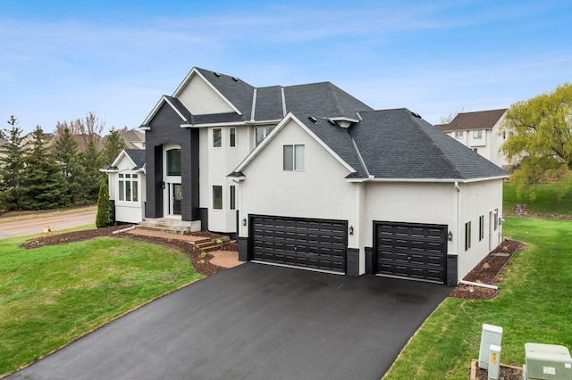 view of front of home featuring roof with shingles, a front lawn, aphalt driveway, a garage, and stucco siding