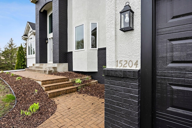 view of property exterior featuring stucco siding and entry steps