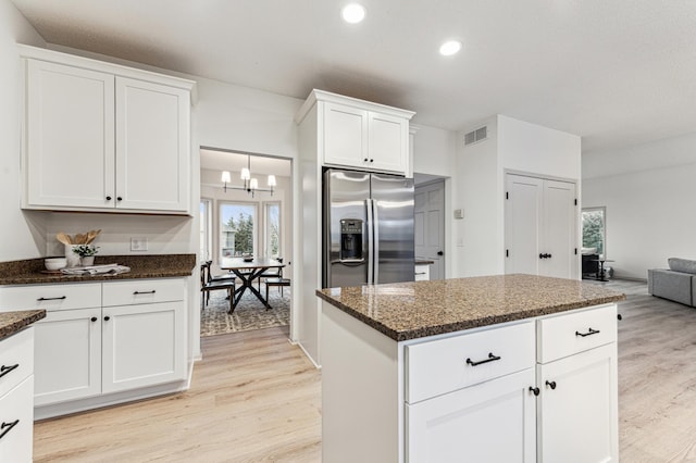 kitchen featuring an inviting chandelier, light wood-style floors, recessed lighting, white cabinets, and stainless steel fridge with ice dispenser