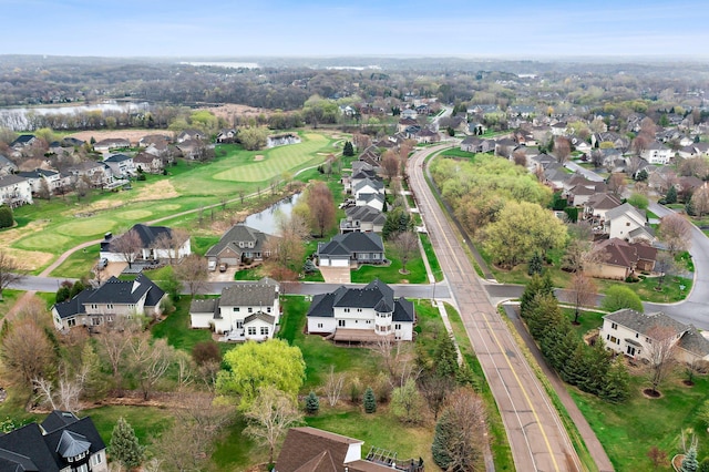 bird's eye view featuring a water view, a residential view, and golf course view