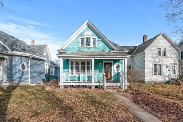 view of front of house featuring a front yard and covered porch