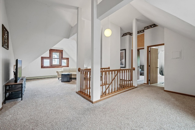 additional living space with carpet flooring, a baseboard radiator, baseboards, and vaulted ceiling