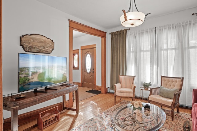 entrance foyer with hardwood / wood-style floors and baseboards