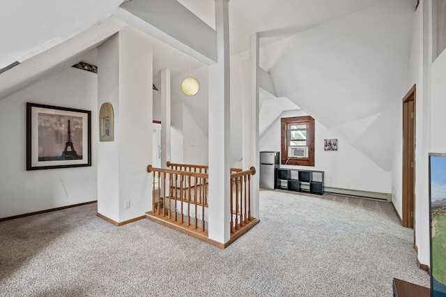 additional living space featuring baseboards, lofted ceiling, baseboard heating, carpet flooring, and cooling unit