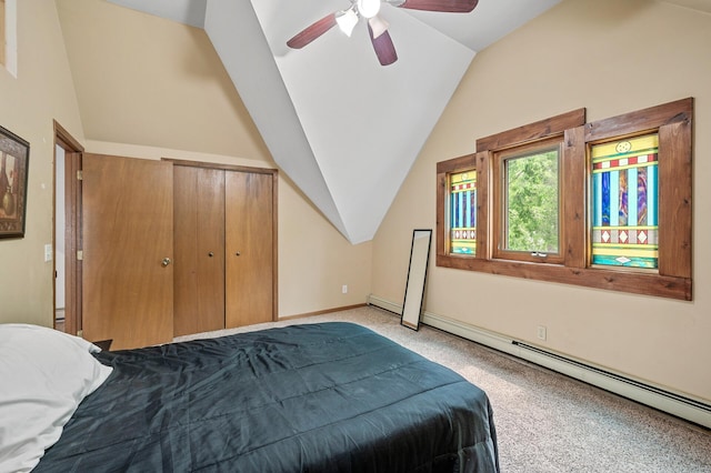 carpeted bedroom with a baseboard heating unit, vaulted ceiling, a ceiling fan, and baseboards