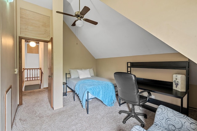 carpeted bedroom with a ceiling fan and vaulted ceiling