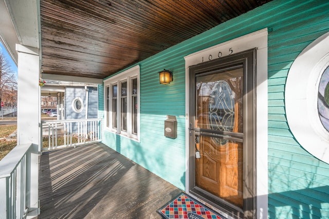 doorway to property featuring covered porch