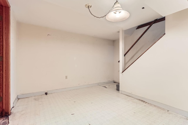 empty room with light floors and baseboards