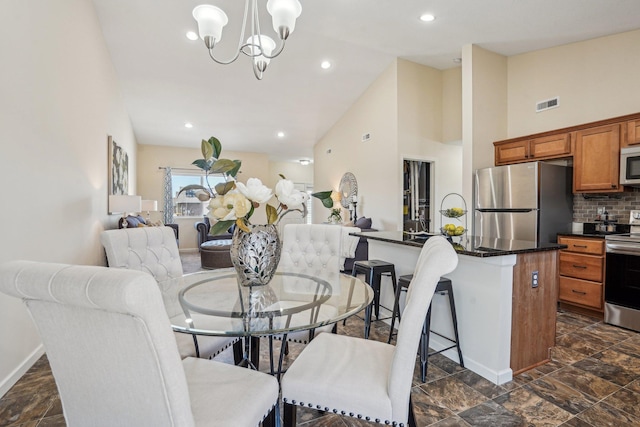 dining space with visible vents, baseboards, recessed lighting, an inviting chandelier, and high vaulted ceiling