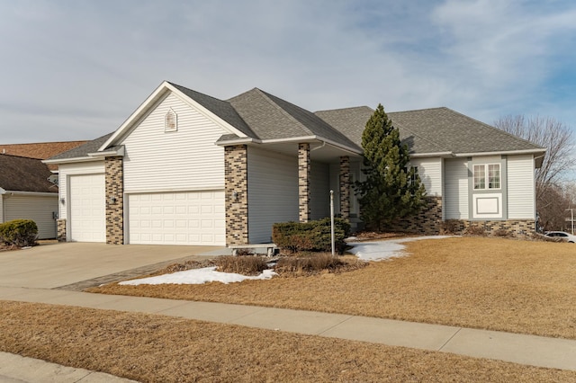 ranch-style home featuring concrete driveway, brick siding, and roof with shingles