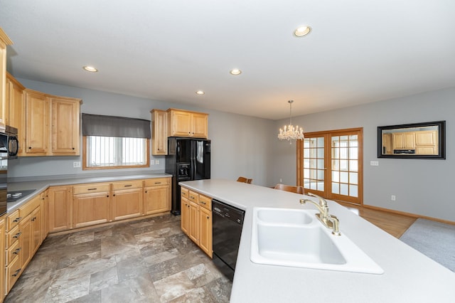 kitchen featuring light brown cabinets, recessed lighting, a sink, black appliances, and light countertops