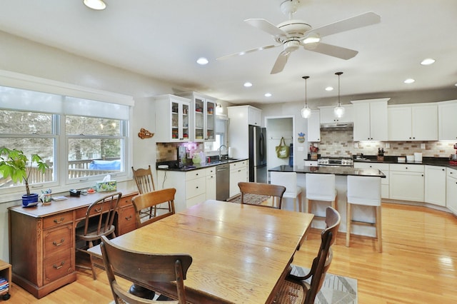 dining area featuring recessed lighting, a ceiling fan, and light wood-style floors