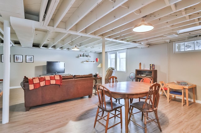 dining room with light wood-style flooring and baseboards