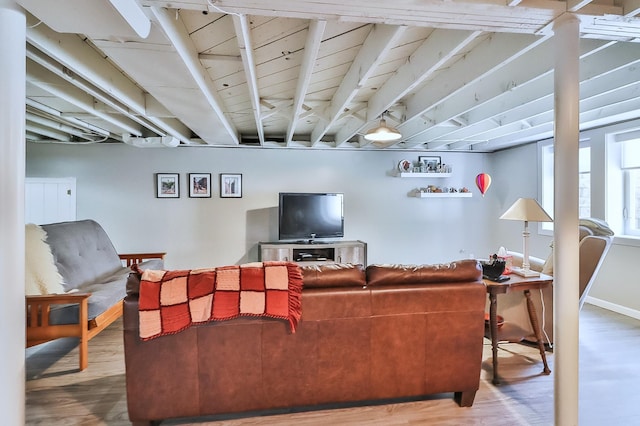 living room featuring baseboards and wood finished floors