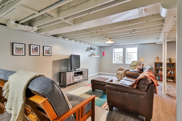 living room with baseboards and wood finished floors