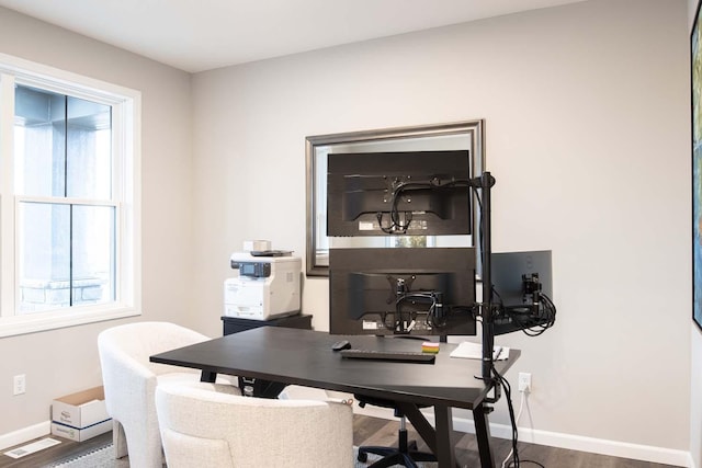 home office featuring visible vents, wood finished floors, and baseboards