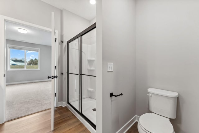 1330 Rose St, New Richmond, WI 54017 - full bathroom with a stall shower, baseboards, and toilet